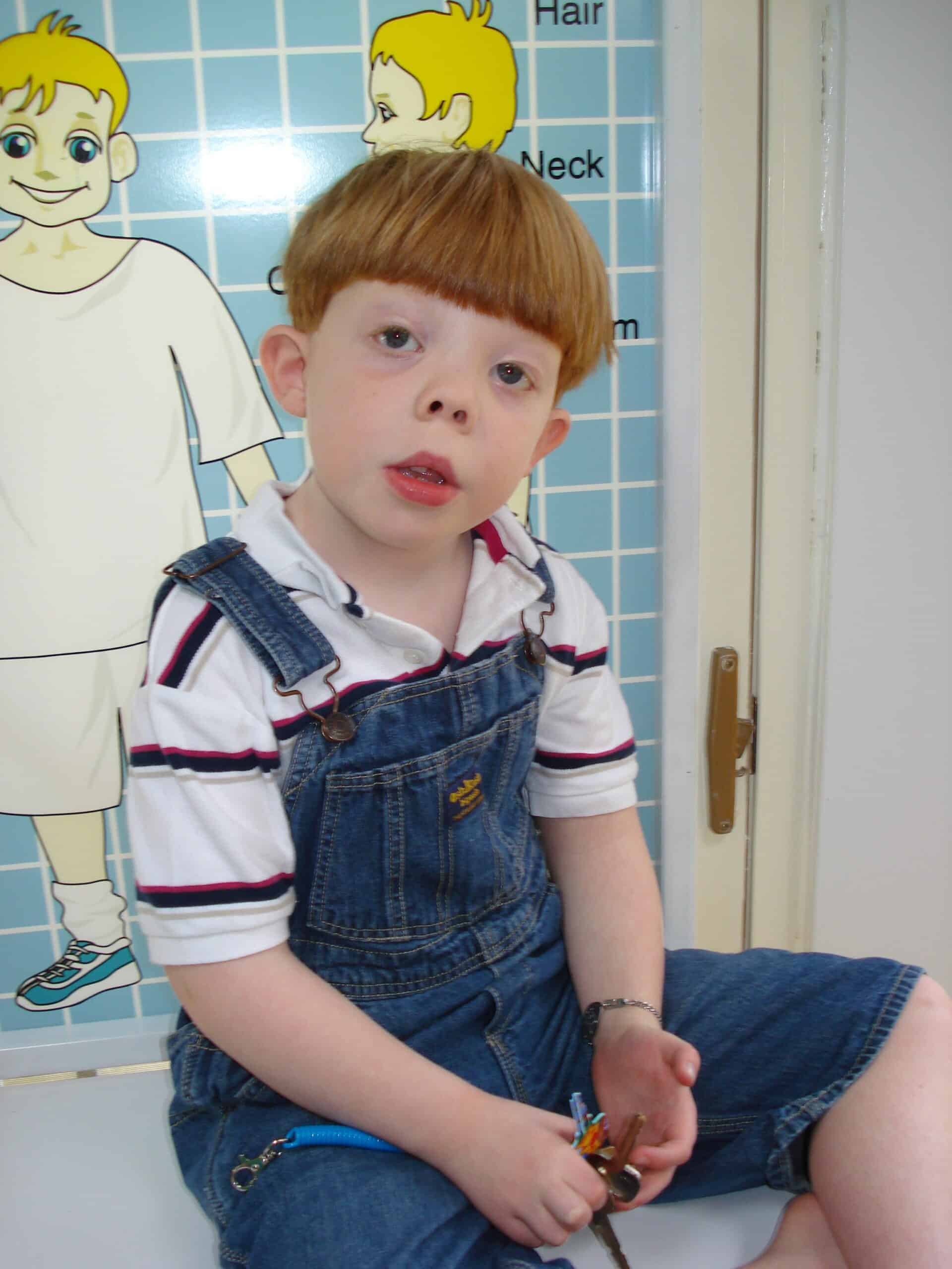 Jukie, a boy with SLOS, in doctor's office